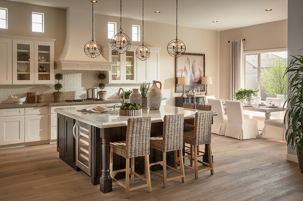 Eat-in kitchen - transitional eat-in kitchen idea in Phoenix with recessed-panel cabinets, white cabinets, soapstone countertops, white backsplash, subway tile backsplash and stainless steel appliances