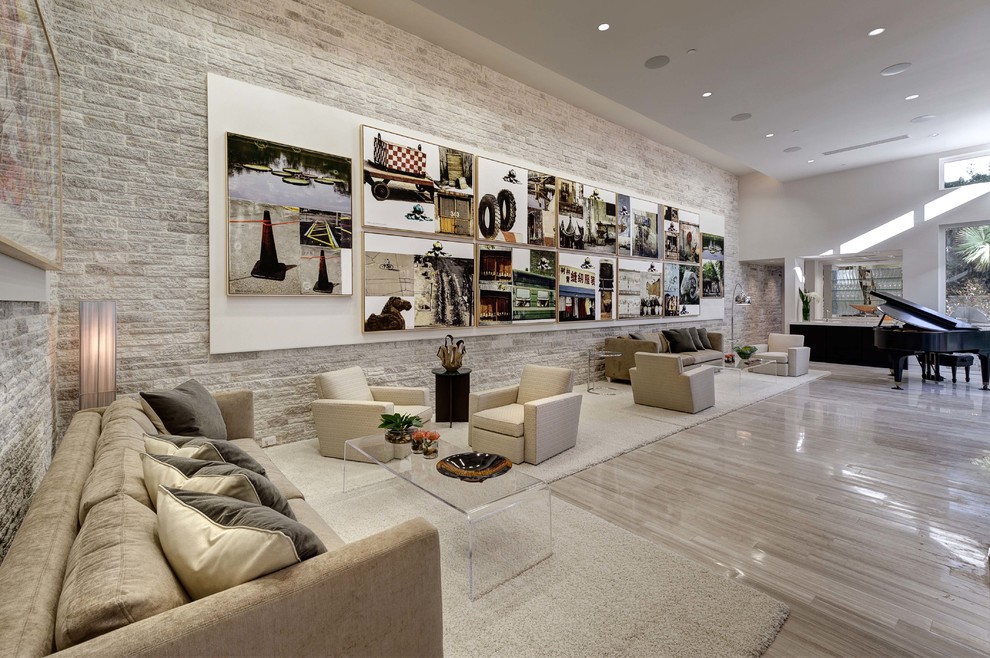 Modern open concept living room in Orlando with a home bar, white walls and limestone floors.