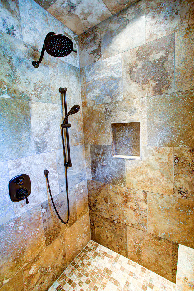 Drop-in bathtub - large rustic master beige tile ceramic tile drop-in bathtub idea with a drop-in sink, raised-panel cabinets, medium tone wood cabinets, a one-piece toilet and white walls
