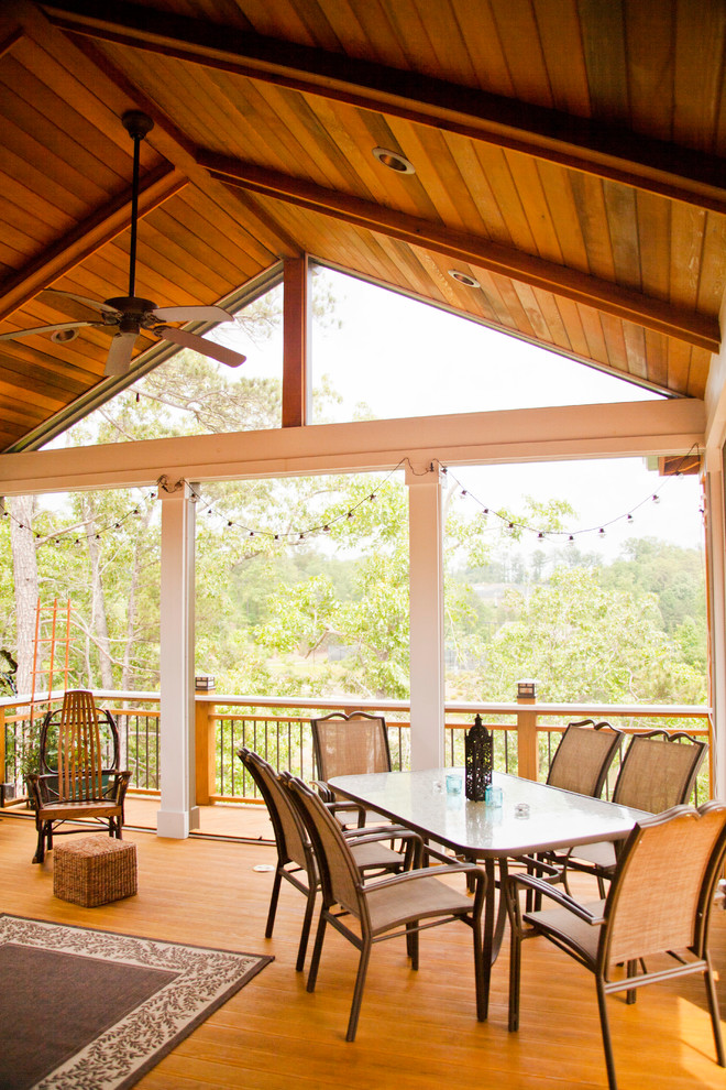 Inspiration for a traditional deck in Atlanta with a roof extension and mixed railing.