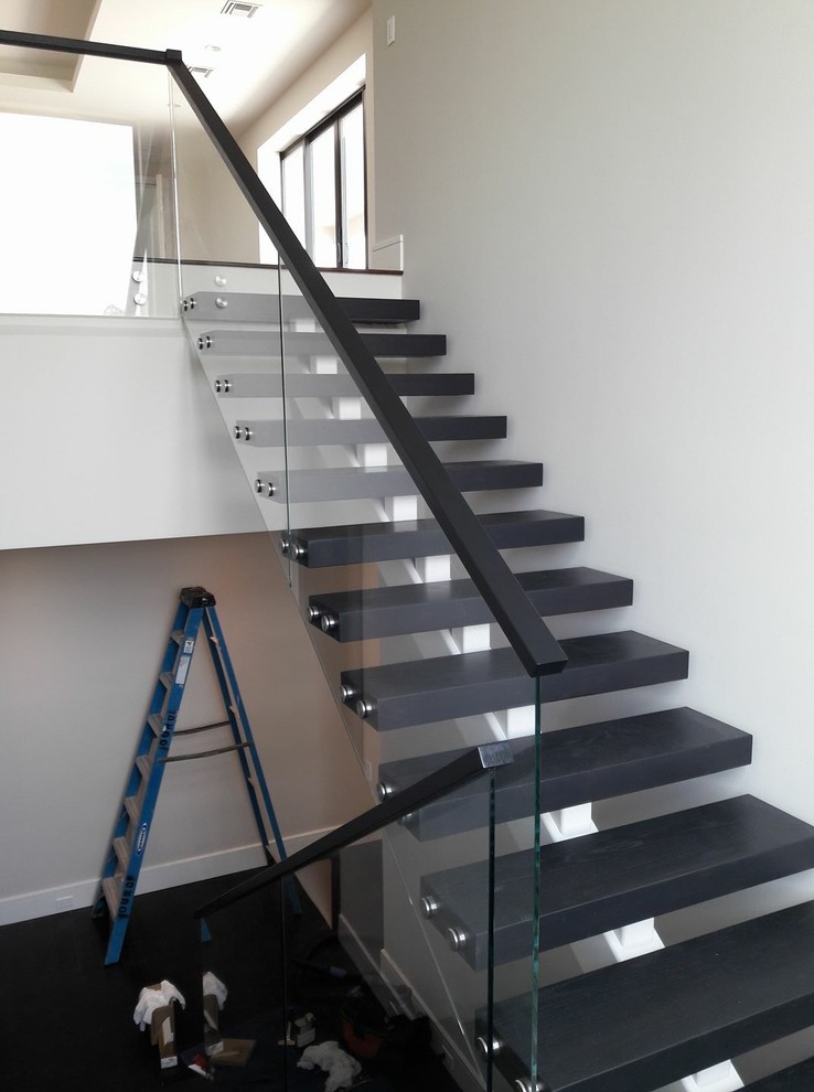 This is an example of a mid-sized modern staircase in Miami.