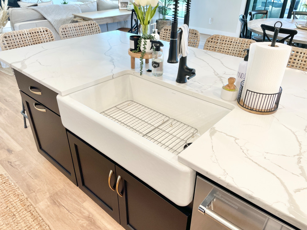 White, Black, and White Oak Open Concept Kitchen and Pantry in