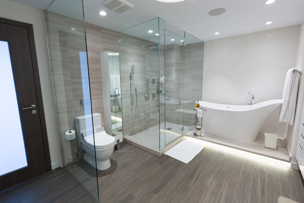 Inspiration for a large contemporary master bathroom in Miami with a japanese tub, a corner shower, a one-piece toilet, white tile, mosaic tile, white walls, porcelain floors, grey floor and a hinged shower door.