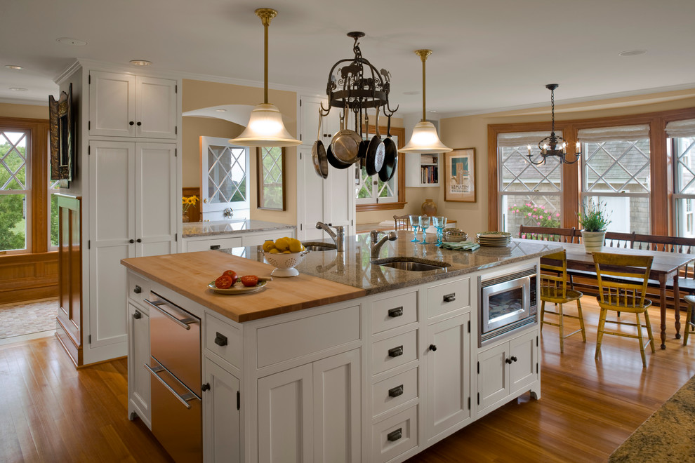 Inspiration for a traditional kitchen in Providence with beaded inset cabinets, granite benchtops and white cabinets.
