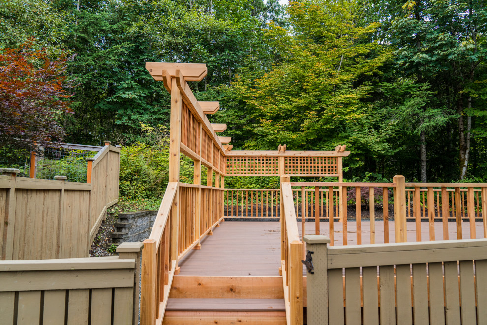 Deck - mid-sized backyard deck idea in Seattle