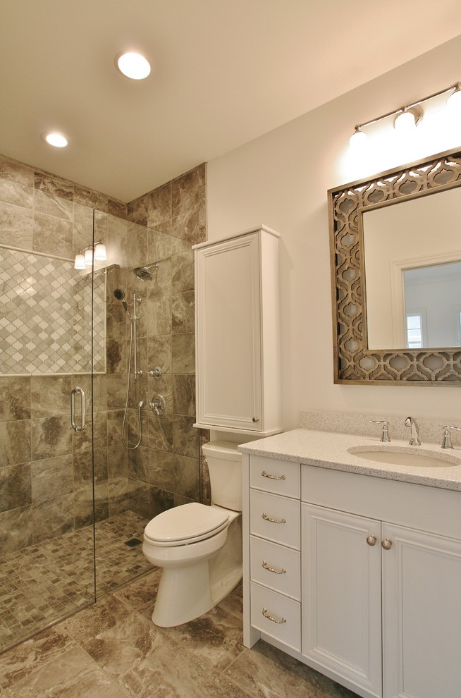 Transitional bathroom photo with flat-panel cabinets, white cabinets and quartz countertops