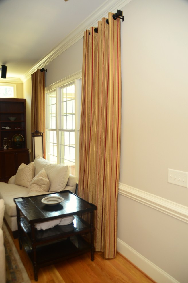 This is an example of a transitional living room in Raleigh.