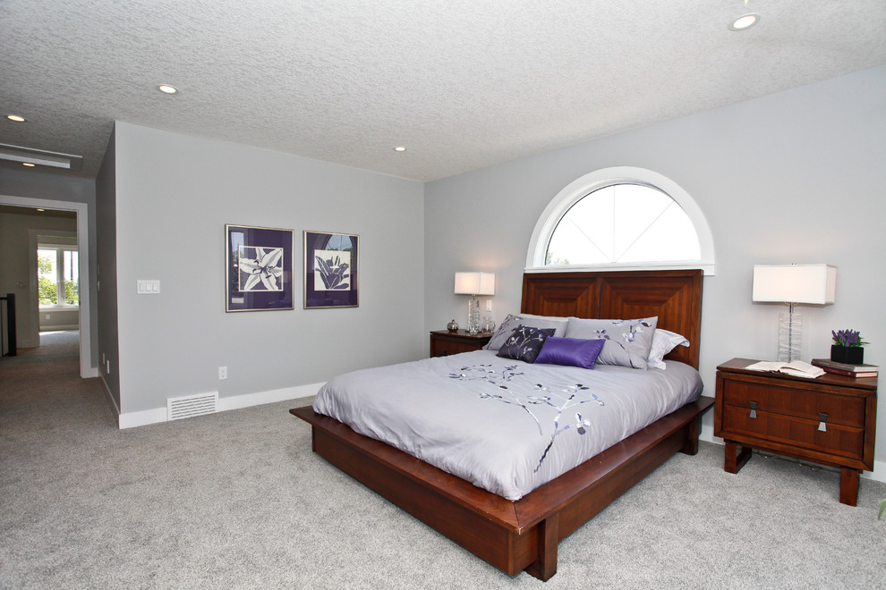 Mid-sized contemporary master bedroom in Calgary with grey walls, carpet, a standard fireplace and a tile fireplace surround.