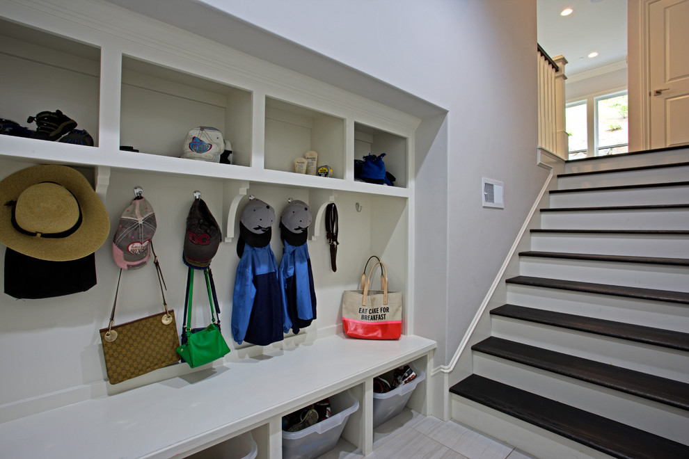 Inspiration for a contemporary mudroom in Sacramento with grey walls and porcelain floors.