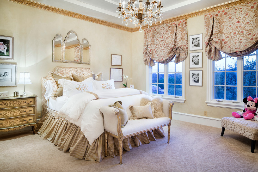 This is an example of a mediterranean kids' bedroom for girls in Austin with beige walls and carpet.