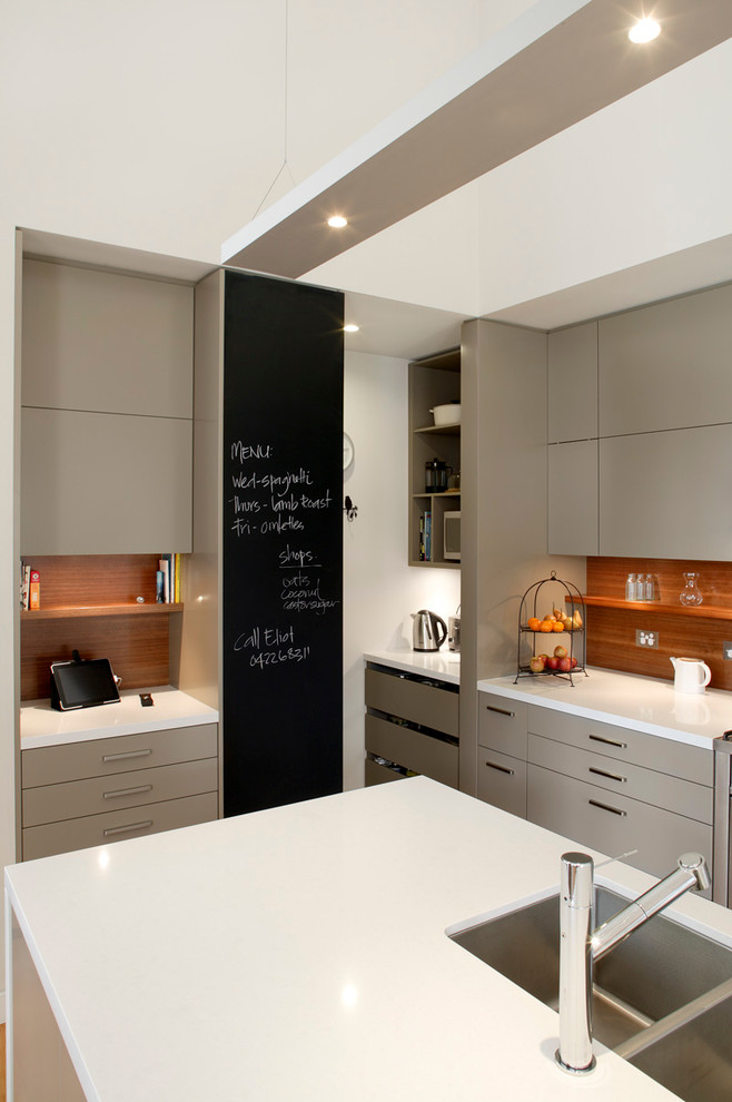 Mid-sized contemporary galley eat-in kitchen in Sydney with an undermount sink, flat-panel cabinets, beige cabinets, quartz benchtops, brown splashback, timber splashback, stainless steel appliances, marble floors and with island.