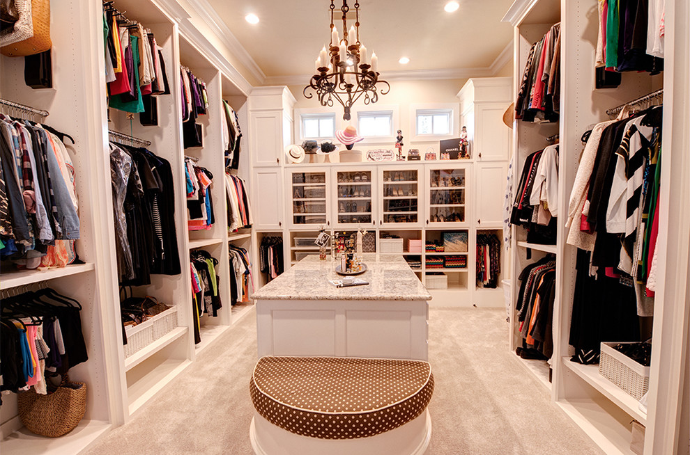 Photo of an expansive traditional women's dressing room in Dallas with shaker cabinets, white cabinets and carpet.