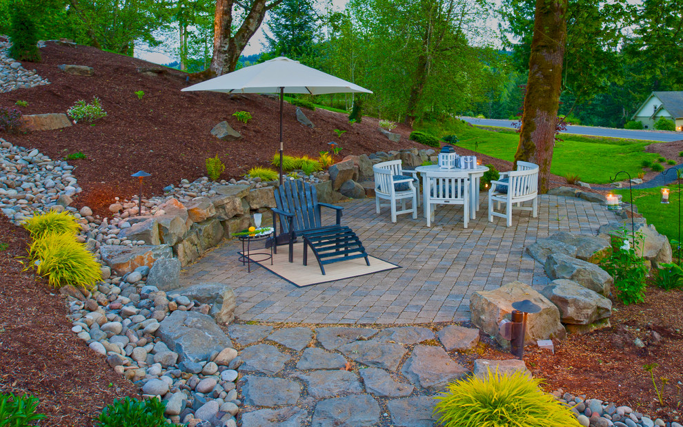 This is an example of a traditional patio in Portland with a pergola.