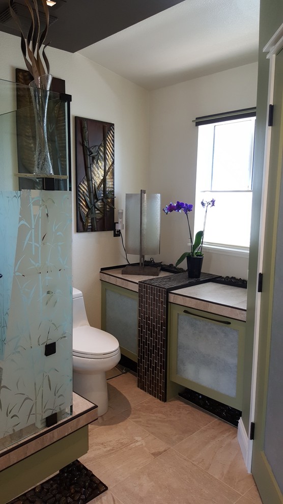 Mid-sized asian master bathroom in San Francisco with shaker cabinets, green cabinets, a shower/bathtub combo, a one-piece toilet, beige tile, porcelain tile, beige walls, porcelain floors, a vessel sink and tile benchtops.