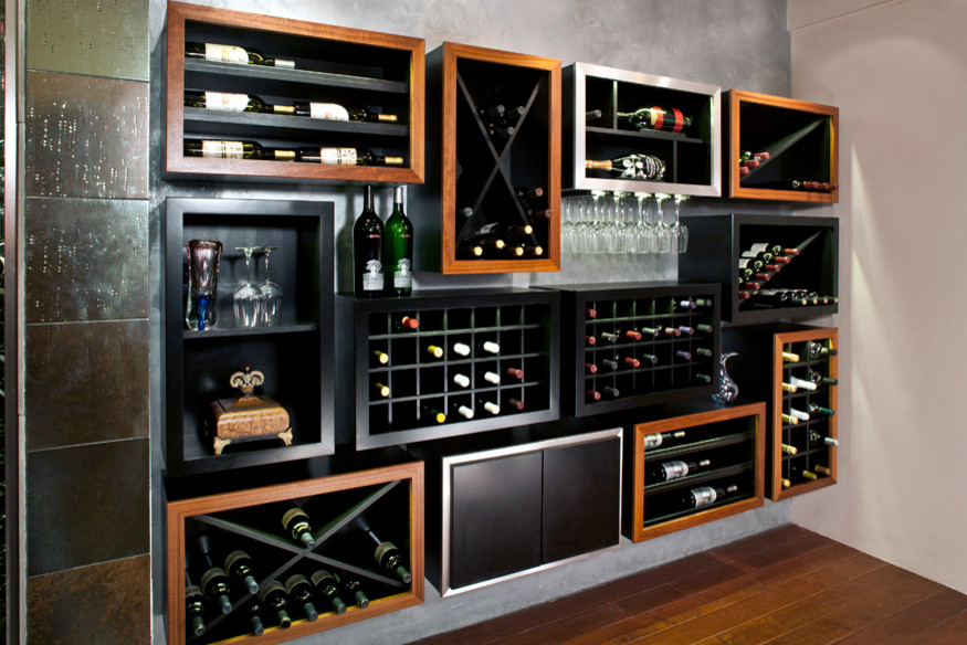 Design ideas for a mid-sized modern wine cellar in Orlando with medium hardwood floors and diamond bins.