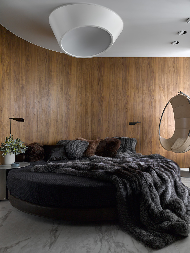 Inspiration for a large contemporary master bedroom in Moscow with brown walls, porcelain floors and grey floor.