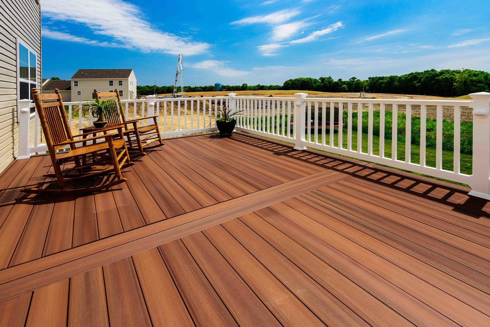 Inspiration for a mid-sized transitional backyard deck remodel with no cover