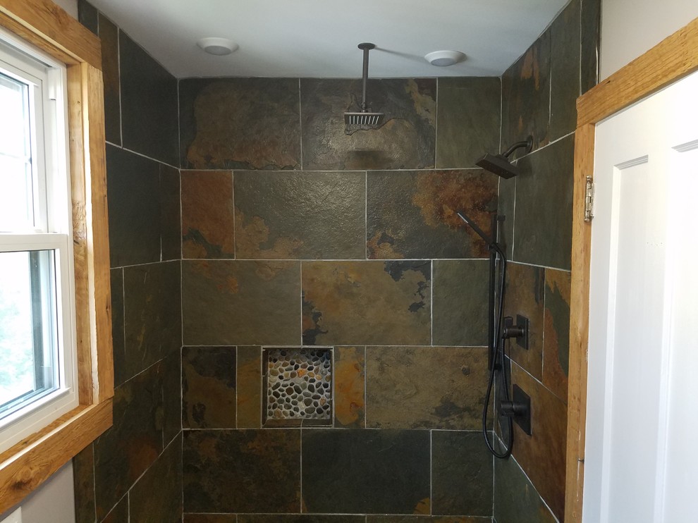 This is an example of a small country 3/4 bathroom in Cincinnati with louvered cabinets, light wood cabinets, a curbless shower, a bidet, multi-coloured tile, slate, beige walls, slate floors, a vessel sink, wood benchtops, multi-coloured floor and an open shower.