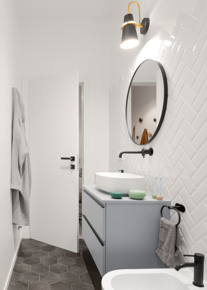 Photo of a small contemporary shower room bathroom in Bologna with flat-panel cabinets, green cabinets, a built-in shower, a wall mounted toilet, white tiles, metro tiles, white walls, cement flooring, a vessel sink, laminate worktops, grey floors, a sliding door, green worktops, a single sink and a floating vanity unit.