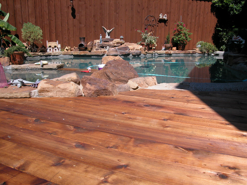 Example of a large transitional backyard deck design in Dallas with no cover
