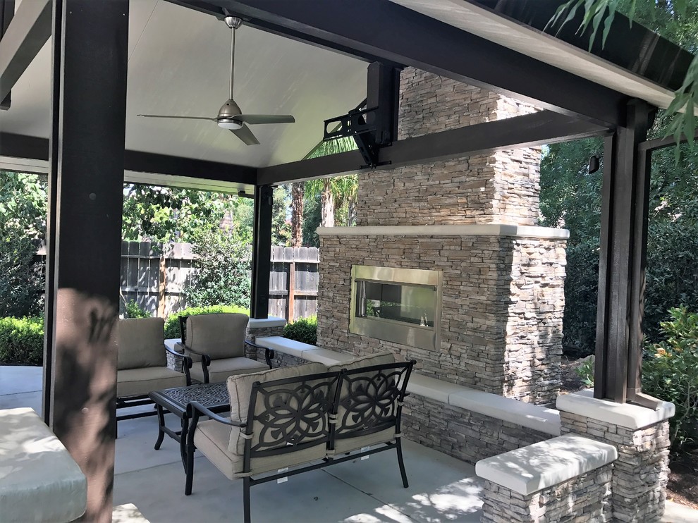 Design ideas for a large traditional backyard patio in Other with an outdoor kitchen, concrete slab and a gazebo/cabana.