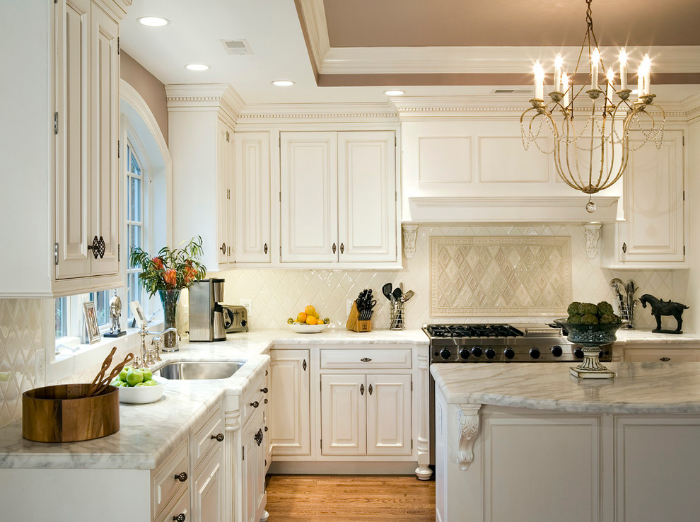 Inspiration for a traditional separate kitchen in DC Metro with beaded inset cabinets, white cabinets, onyx benchtops, white splashback, cement tile splashback and multiple islands.