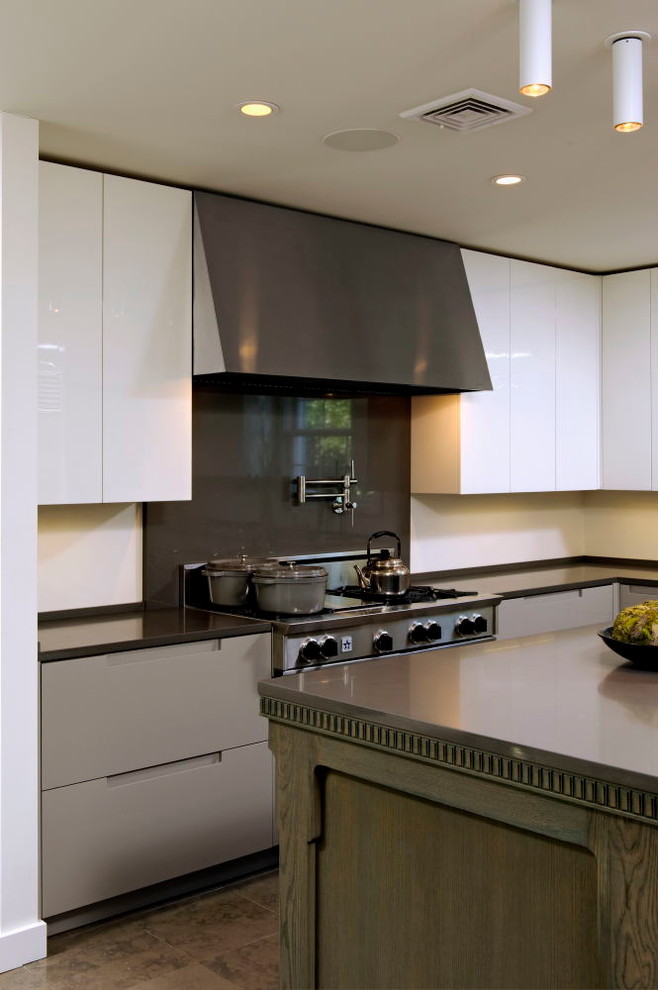 Inspiration for a mid-sized modern u-shaped eat-in kitchen in DC Metro with an undermount sink, grey cabinets, black splashback, stainless steel appliances, ceramic floors, with island, flat-panel cabinets, solid surface benchtops and stone slab splashback.