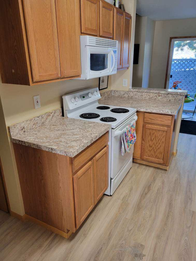 Solid Surface Countertops with All Wood Cabinets