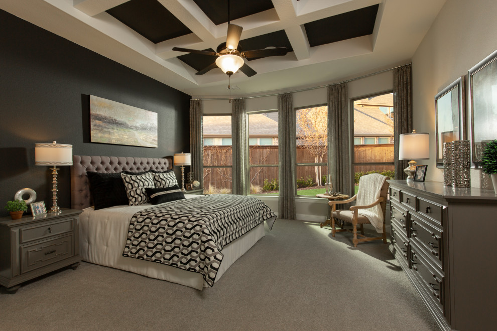 Large master bedroom in Houston with grey walls, carpet, grey floor and coffered.