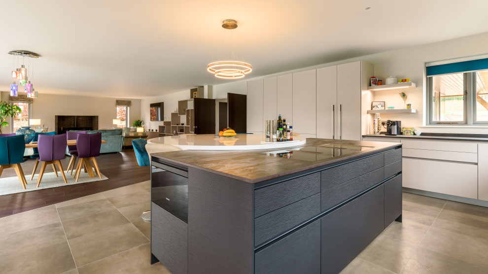 Design ideas for a large contemporary u-shaped open plan kitchen in Sussex with with island.