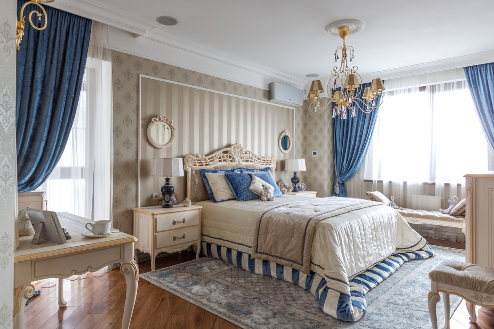 Inspiration for a traditional master bedroom in Other with dark hardwood floors, brown floor and beige walls.