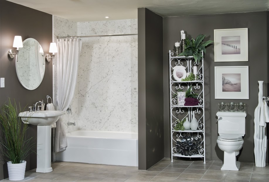 Mid-sized transitional 3/4 bathroom in Other with furniture-like cabinets, white cabinets, an alcove tub, a shower/bathtub combo, a two-piece toilet, beige tile, white tile, marble, brown walls, porcelain floors, a pedestal sink, marble benchtops, beige floor and a shower curtain.
