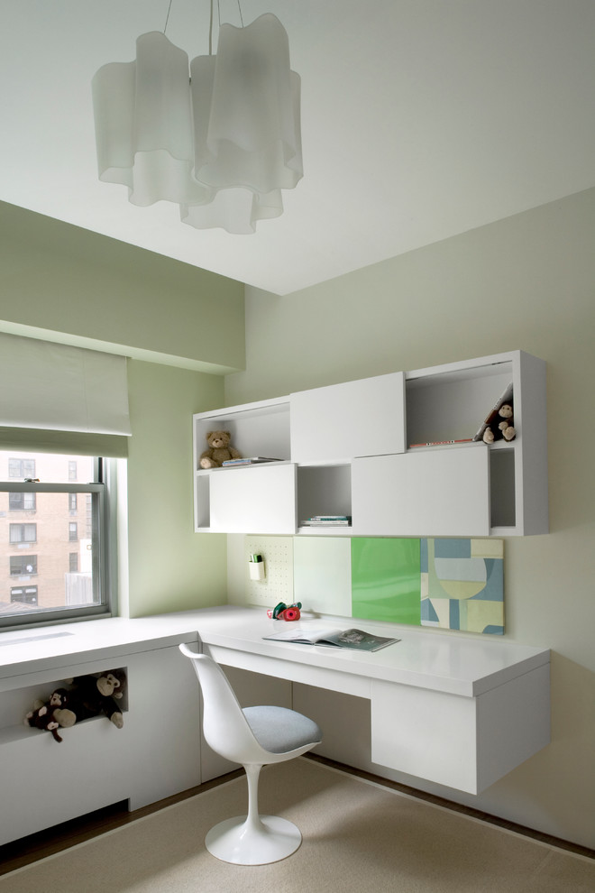 Design ideas for a modern kids' room in New York with green walls.