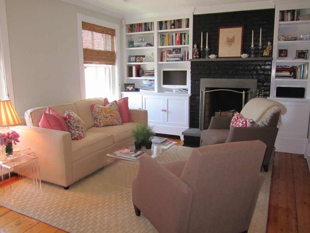 Inspiration for a mid-sized transitional formal enclosed living room in Boston with white walls, plywood floors, a standard fireplace, a brick fireplace surround and no tv.