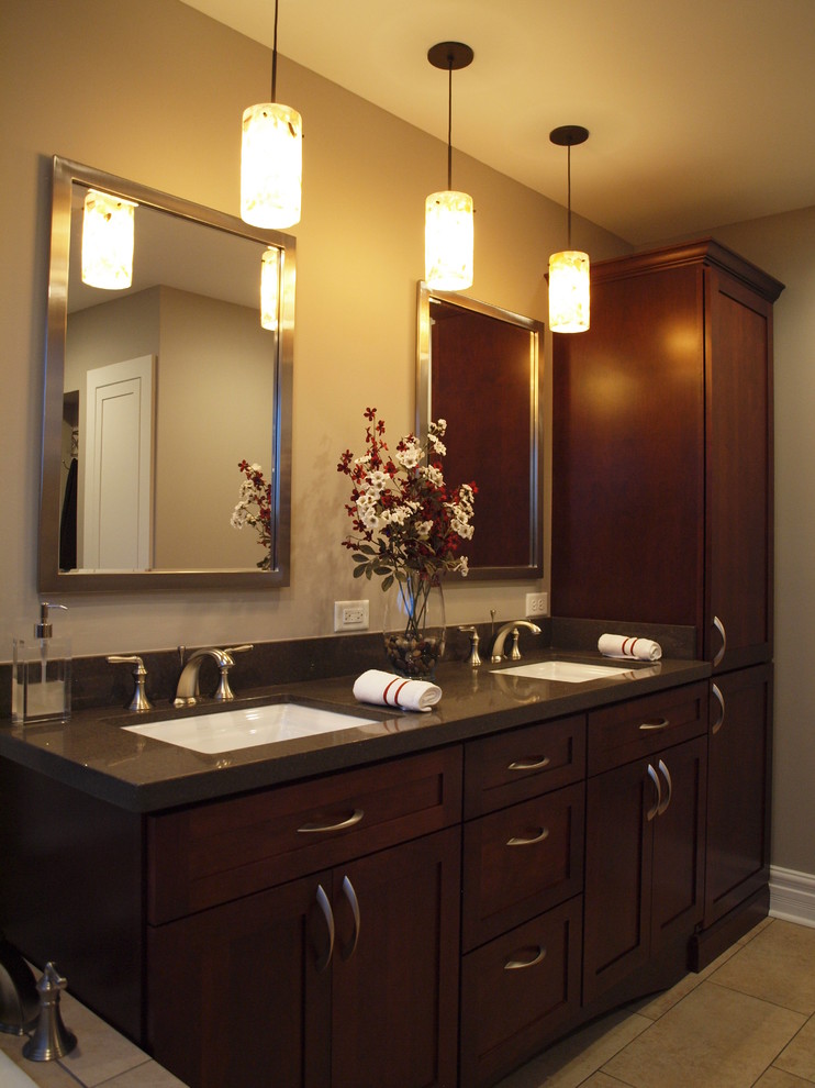 This is an example of a mid-sized traditional master bathroom in Chicago with an undermount sink, shaker cabinets, dark wood cabinets, engineered quartz benchtops and beige walls.