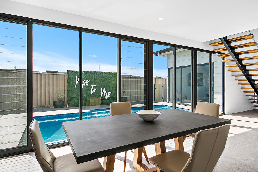Photo of a large contemporary dining room in Wollongong.