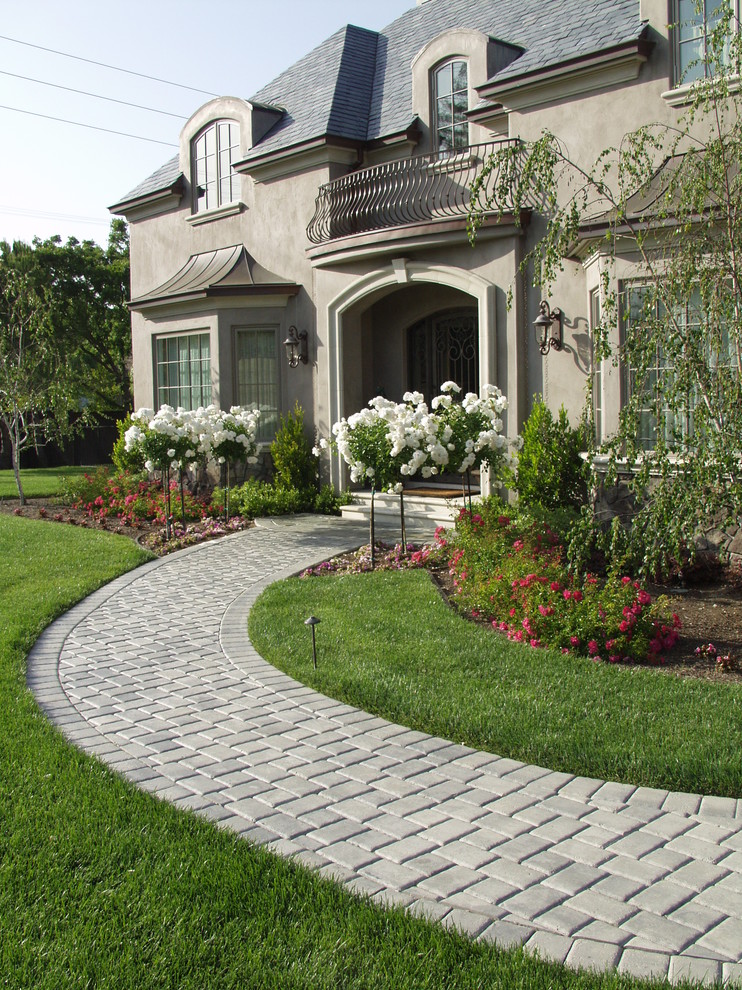 Design ideas for a mediterranean full sun front yard stone driveway in San Francisco.