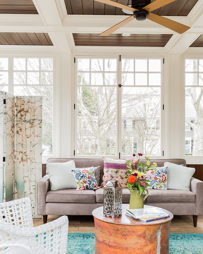 This is an example of a beach style sunroom in Boston.