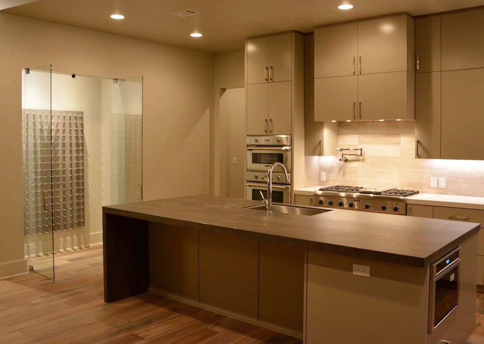 Large modern single-wall kitchen in Charlotte with flat-panel cabinets.