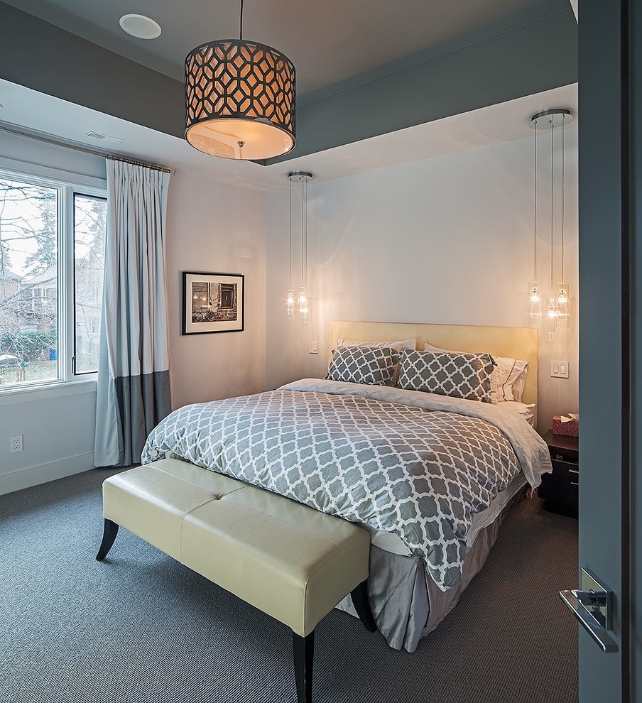 Photo of a mid-sized contemporary master bedroom in Toronto with white walls, carpet, no fireplace and grey floor.