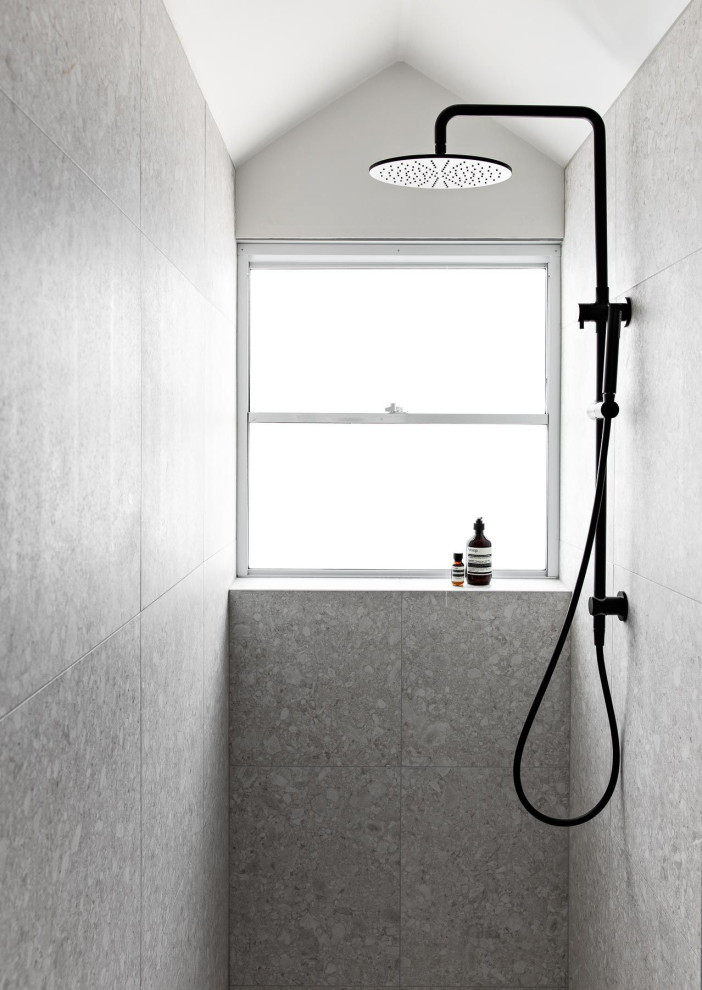 Photo of an urban bathroom in Sydney with a double shower, white tiles, marble flooring, tiled worktops, a wall niche, a single sink, wainscoting, white cabinets and porcelain tiles.