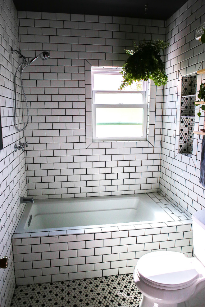 Design ideas for a small traditional master bathroom in Orange County with an alcove tub, a two-piece toilet, black and white tile, ceramic tile, black walls, ceramic floors, a pedestal sink and white floor.