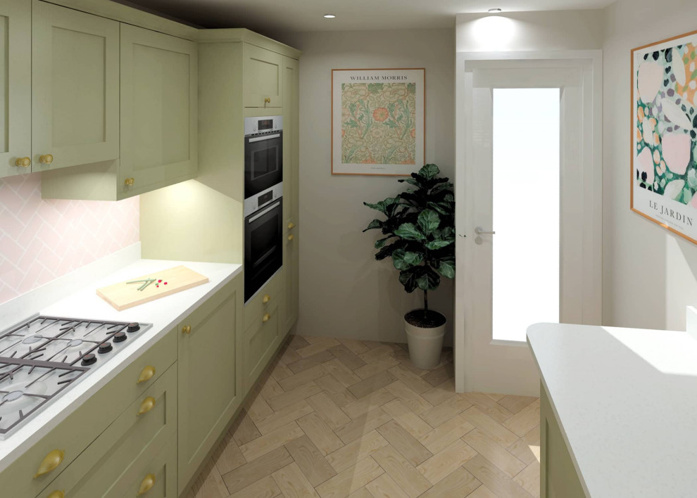 This is an example of a small modern u-shaped enclosed kitchen in Sussex with shaker cabinets, green cabinets, no island and white worktops.
