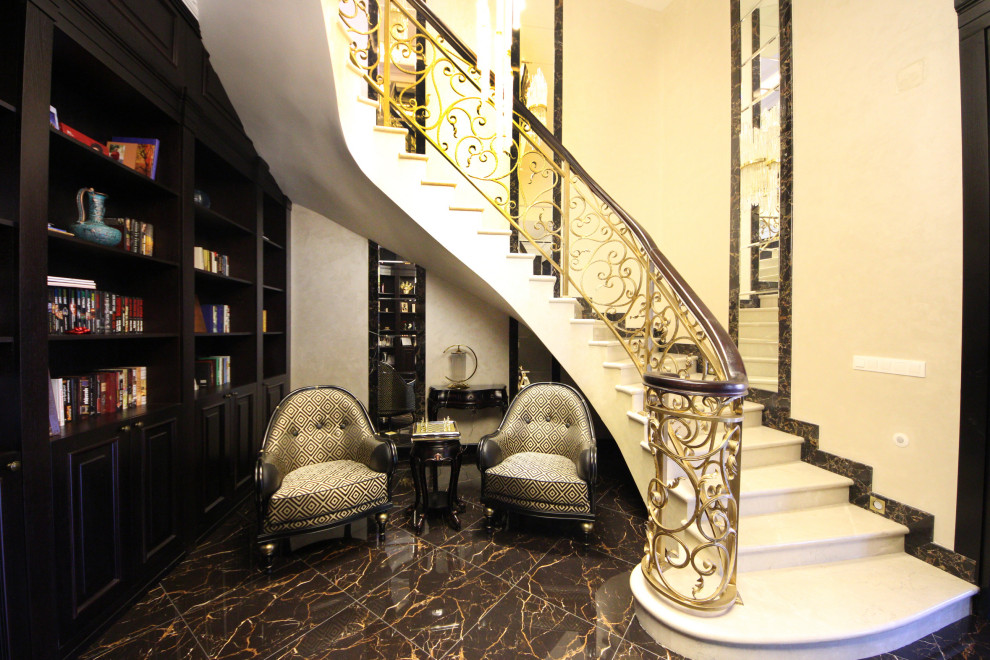 Design ideas for a large eclectic marble u-shaped staircase in Moscow with marble risers, metal railing and wallpaper.