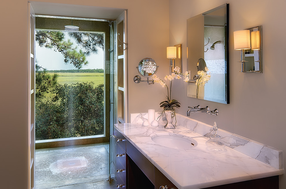 Photo of a contemporary bathroom in Charleston with marble benchtops.
