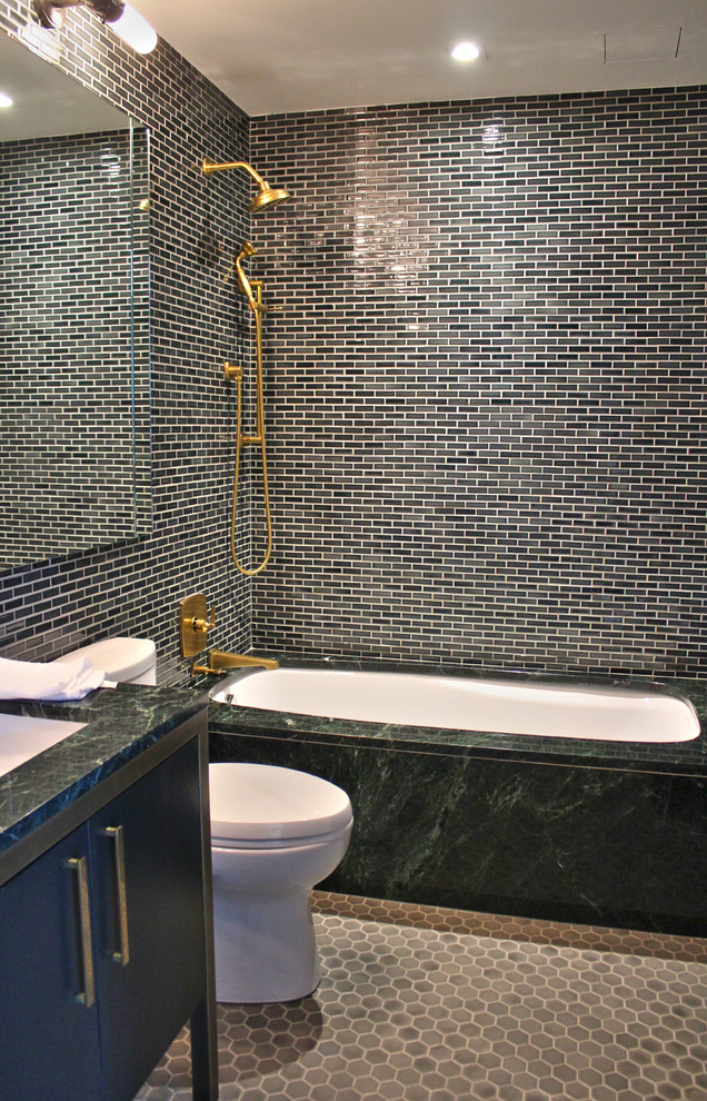 This is an example of a mid-sized modern 3/4 bathroom in New York with an undermount tub, an open shower, green tile, green walls, a drop-in sink, flat-panel cabinets and green cabinets.