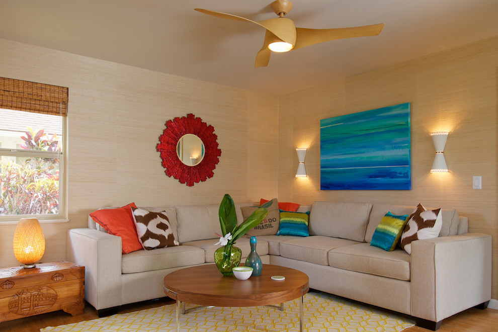 Design ideas for a mid-sized tropical open concept living room in Los Angeles with beige walls.
