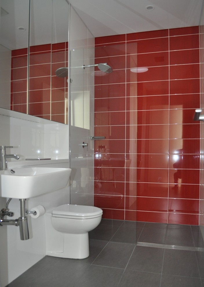 Inspiration for a contemporary bathroom in Sydney with flat-panel cabinets, an open shower and ceramic floors.