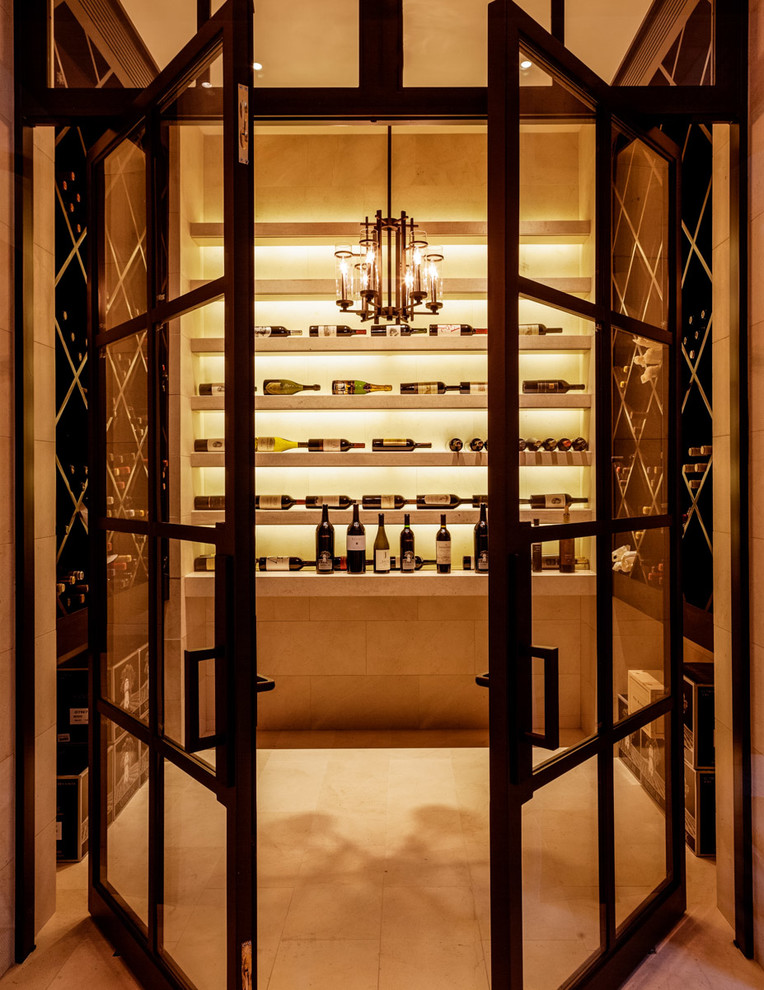 Design ideas for a mediterranean wine cellar in Dallas with display racks and beige floor.