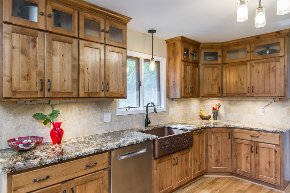 Eat-in kitchen - large rustic light wood floor eat-in kitchen idea with a farmhouse sink, light wood cabinets, granite countertops, beige backsplash, glass tile backsplash, stainless steel appliances and beige countertops